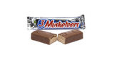 A 3 Musketeers chocolate bar, broken in half to show the inside of the bar, with it's packaging in the background